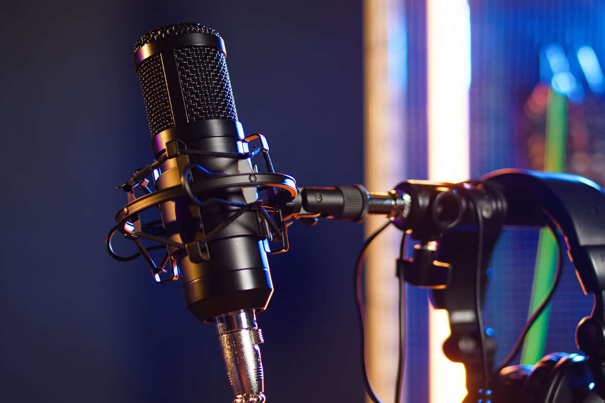 Microphone attached to a stand with a lit up background