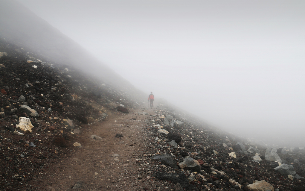 A Climber walking alone on a mountain